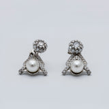 Elegance in Silver: Pearl and Diamond Pendant Set