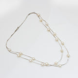 Silver Serenity: Pearl Adorned Necklace