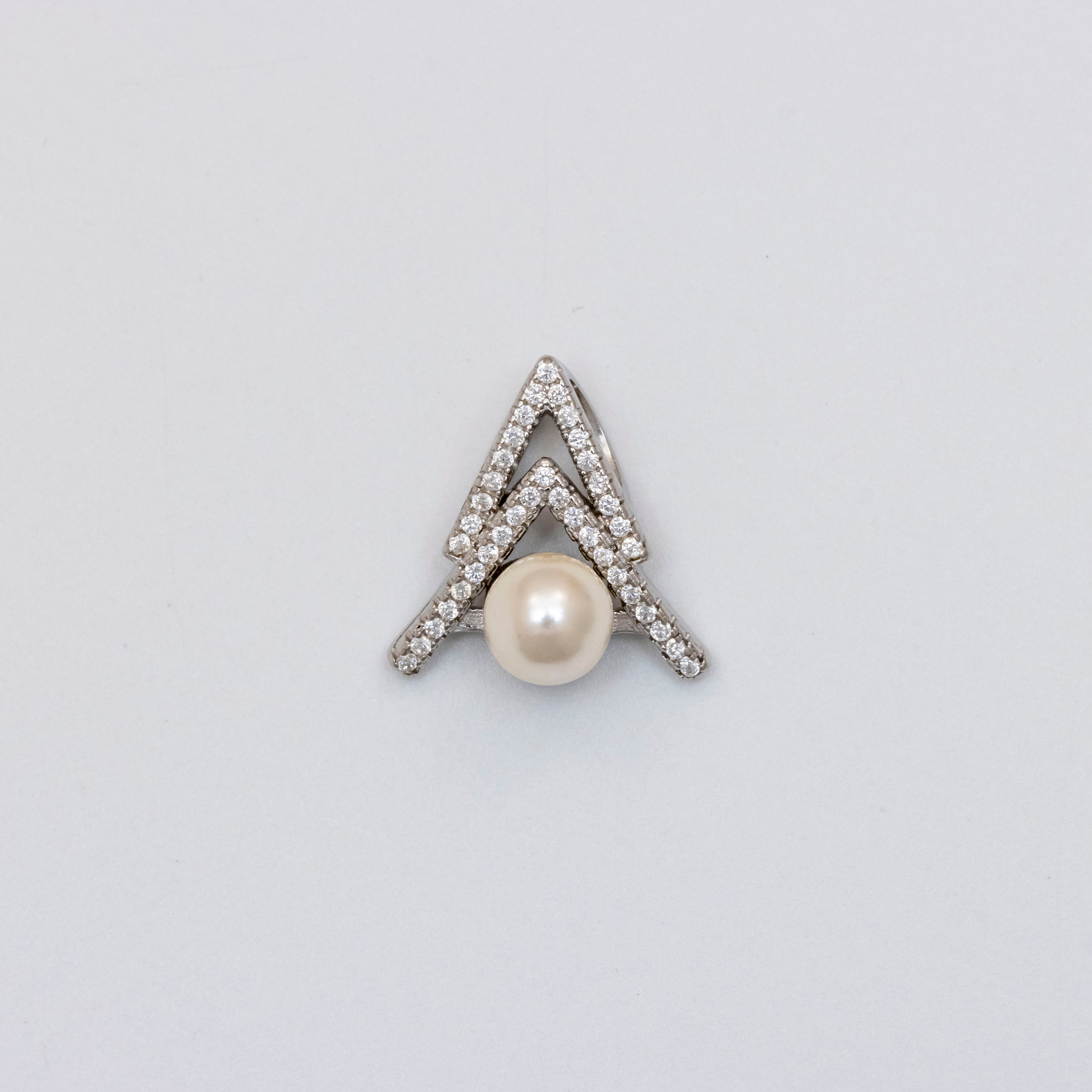 Elegance in Silver: Pearl and Diamond Pendant Set